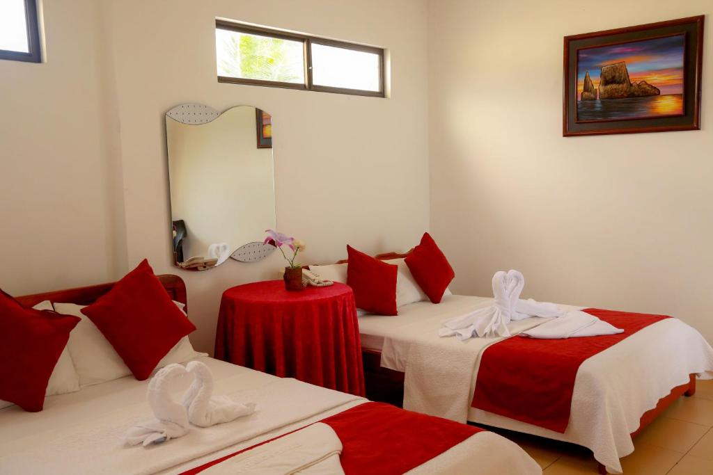 Postel nebo postele na pokoji v ubytování Hostal Sir Francis Drake