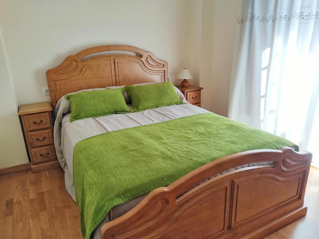 A bed or beds in a room at Pension a Fontiña
