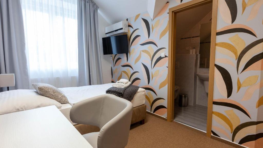 Postel nebo postele na pokoji v ubytování Penzion Solid Spa