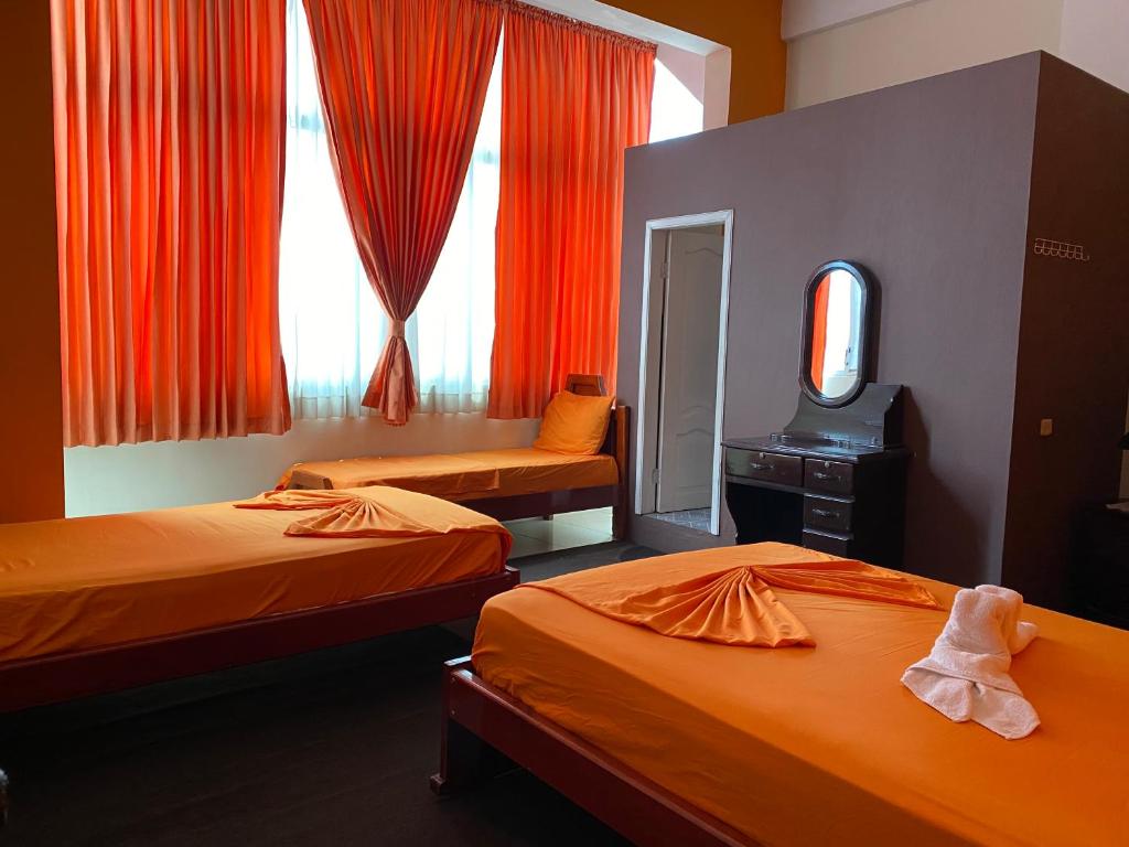 Postel nebo postele na pokoji v ubytování Hostal Puerto Azul