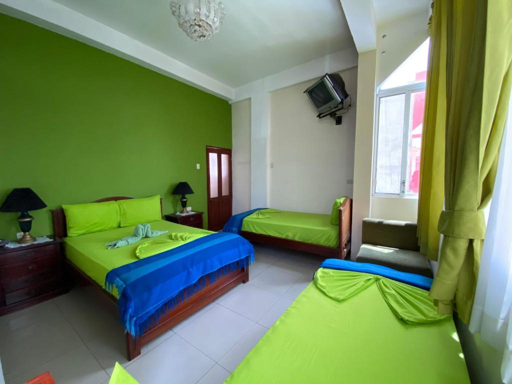 Postel nebo postele na pokoji v ubytování Hostal Puerto Azul