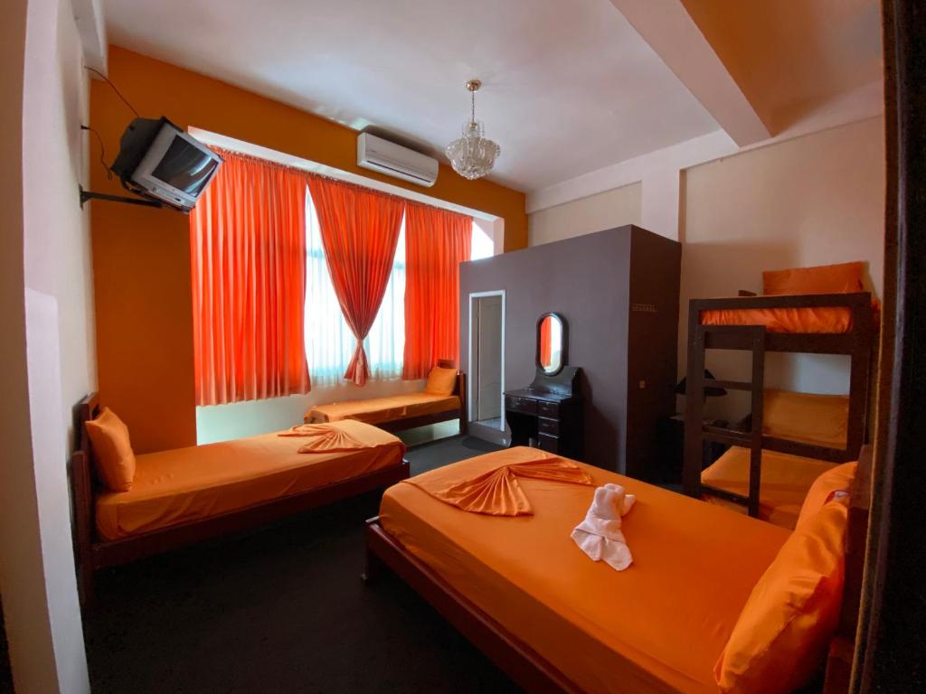 Postel nebo postele na pokoji v ubytování Hostal Puerto Azul