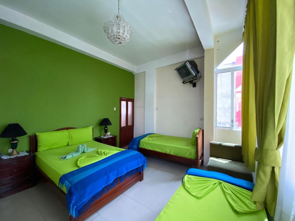 Postel nebo postele na pokoji v ubytování Hostal Puerto Azul
