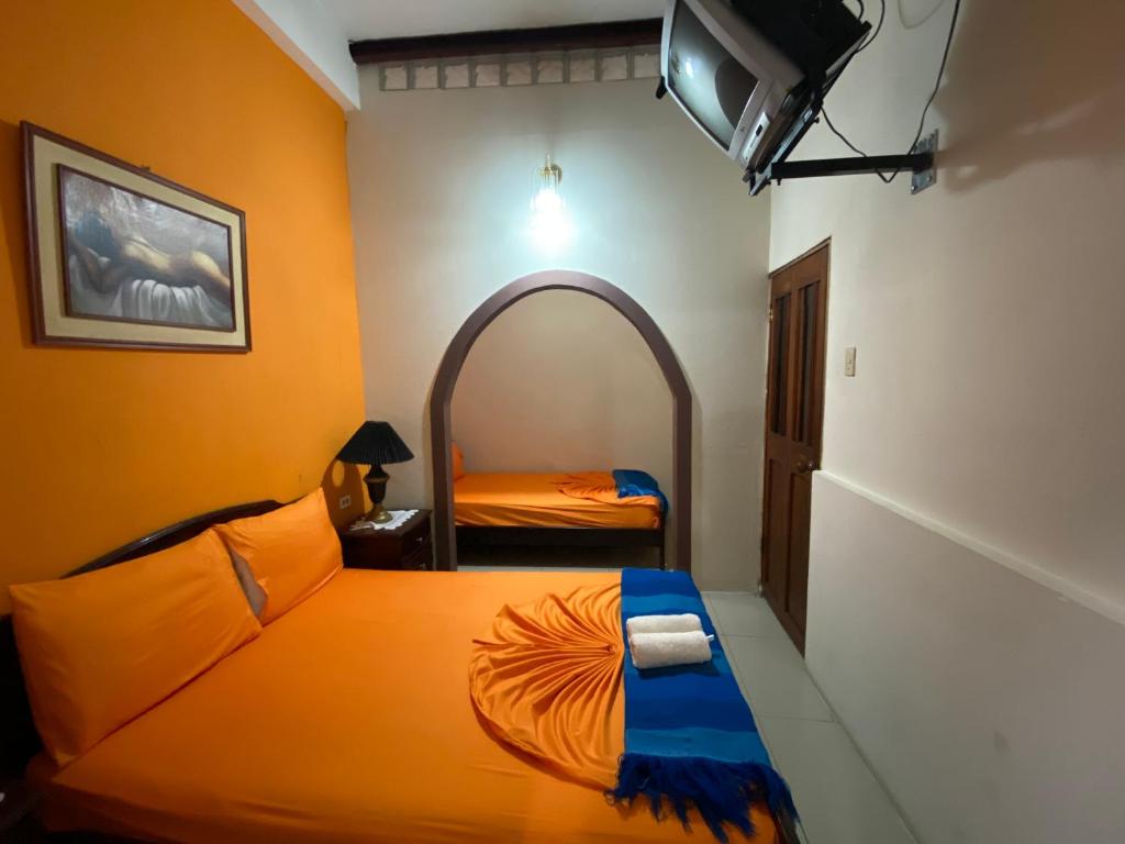 Postel nebo postele na pokoji v ubytování Hostal Puerto Azul