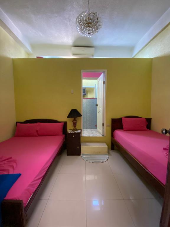 Postel nebo postele na pokoji v ubytování Hostal Puerto Azul