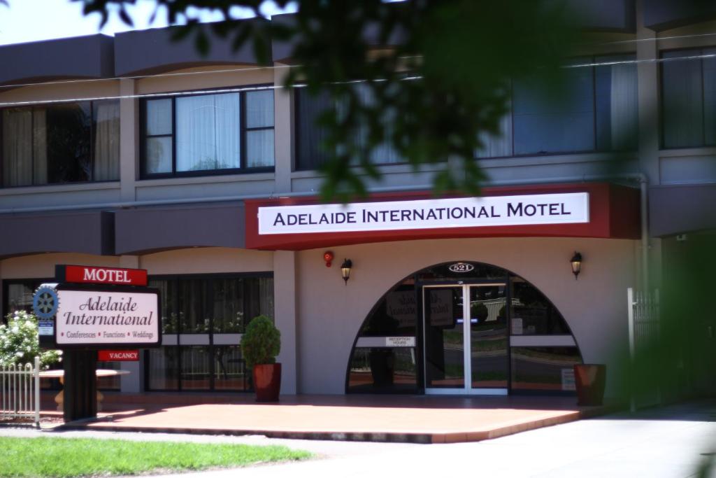 a building with an entrance to anadobe international hospital at Adelaide International Motel in Adelaide