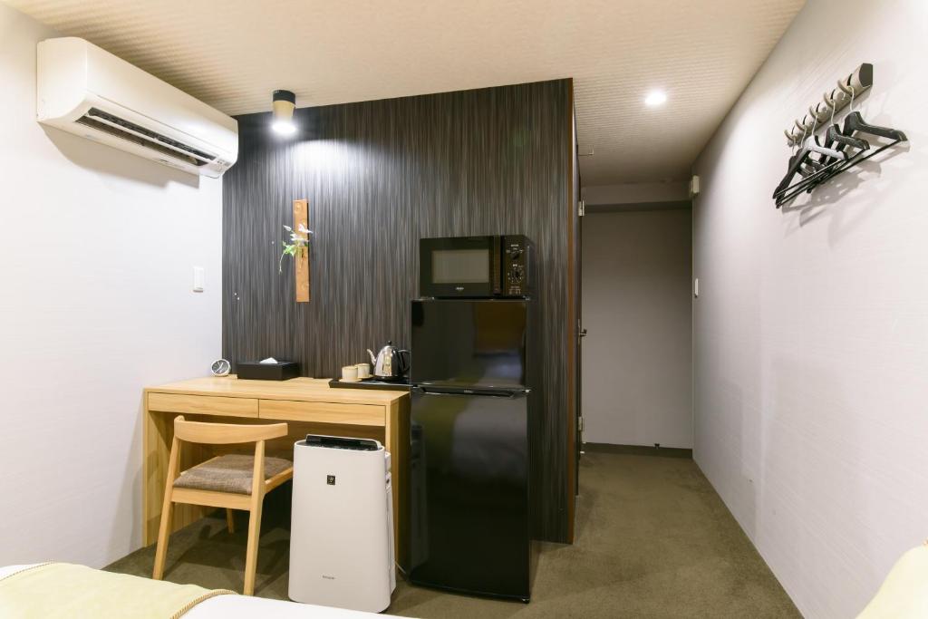 Kuchyň nebo kuchyňský kout v ubytování JP INN Kyoto Ekimae Mongakucho
