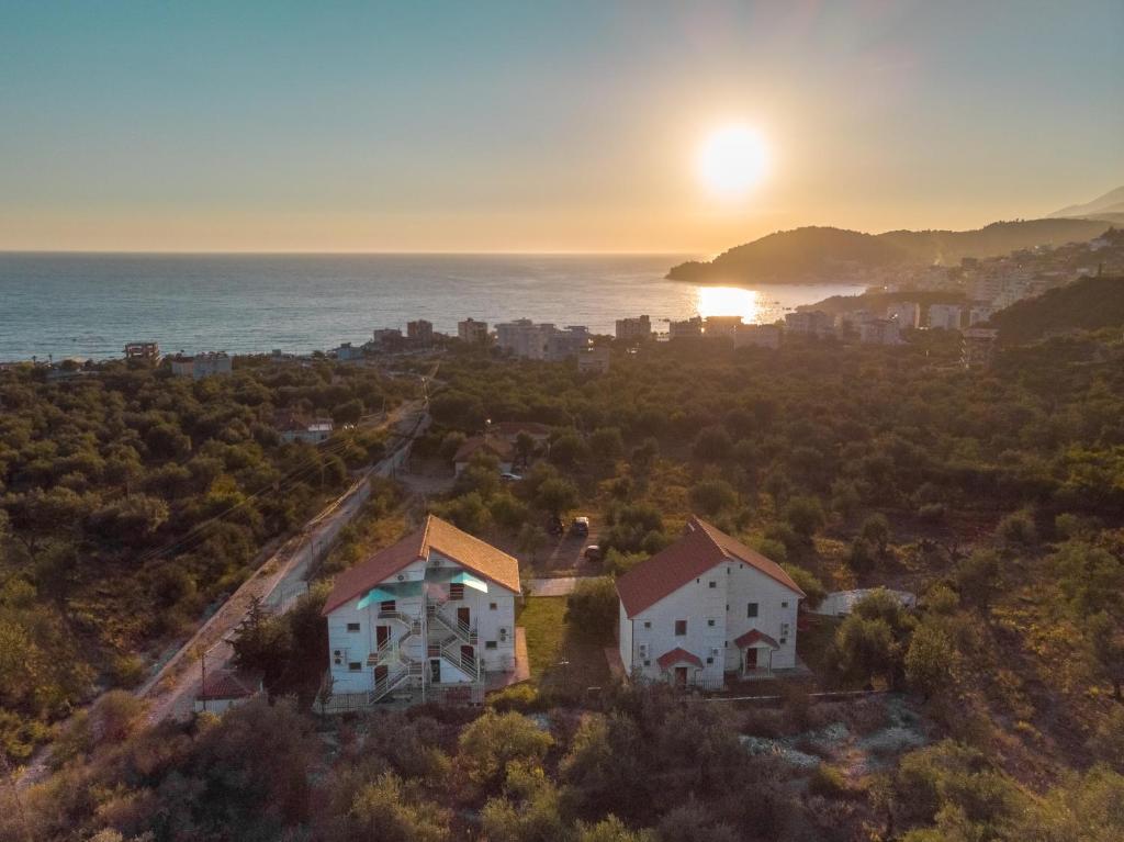 an aerial view of a house with the sunset in the background at Aria Prive in Himare