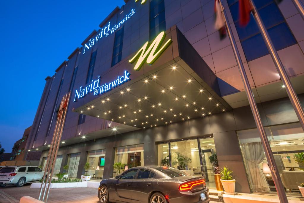 a car parked in front of a building at Naviti Warwick Al Khobar in Al Khobar