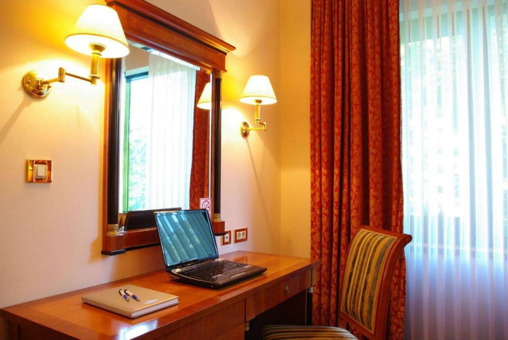 Telewizja i/lub zestaw kina domowego w obiekcie Hotel AS