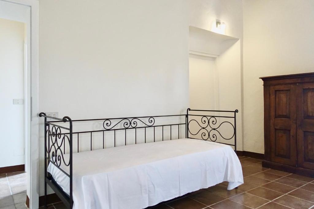 Łóżko lub łóżka w pokoju w obiekcie Casa alla Vecchia Posta di Bagno Vignoni