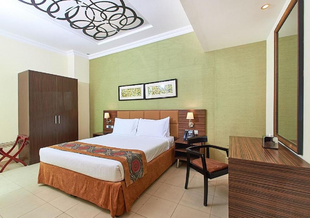 Postel nebo postele na pokoji v ubytování Mughal Suites