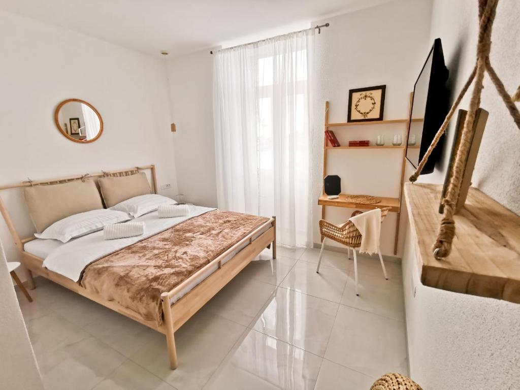 a bedroom with a large bed in a room at Litore in Pula