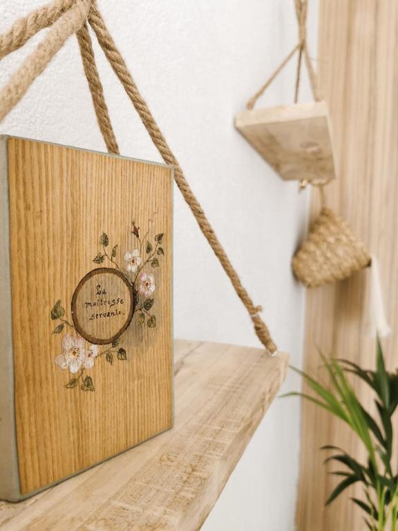 a wooden box on a shelf with a clock on it at Litore in Pula