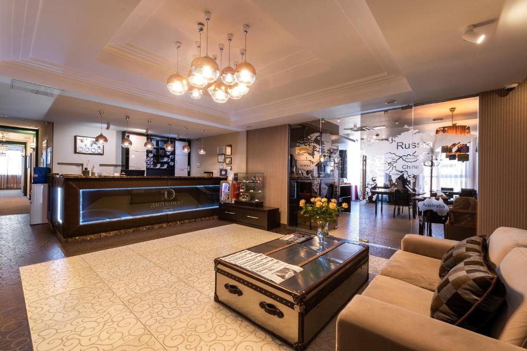 a living room with a couch and a table at Business Hotel Diplomat in Nizhny Novgorod