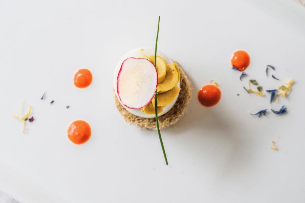 a bowl of food with fruit on a white surface at Chalet Pineta relax location in Canazei