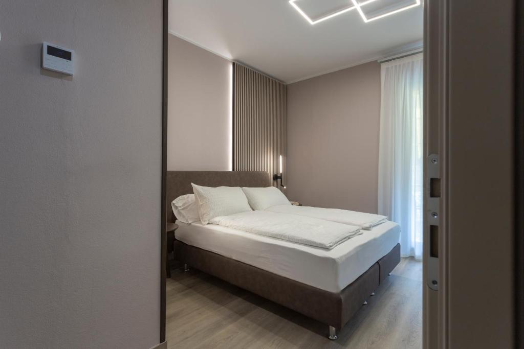 Postel nebo postele na pokoji v ubytování Hotel Veronesi