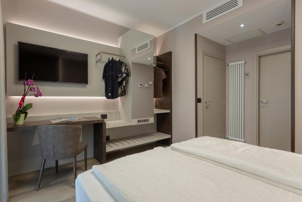 Postel nebo postele na pokoji v ubytování Hotel Veronesi