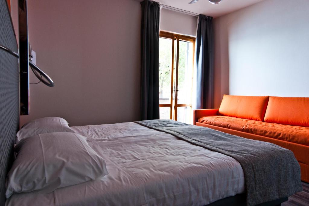 Postelja oz. postelje v sobi nastanitve Hotel Gasparina