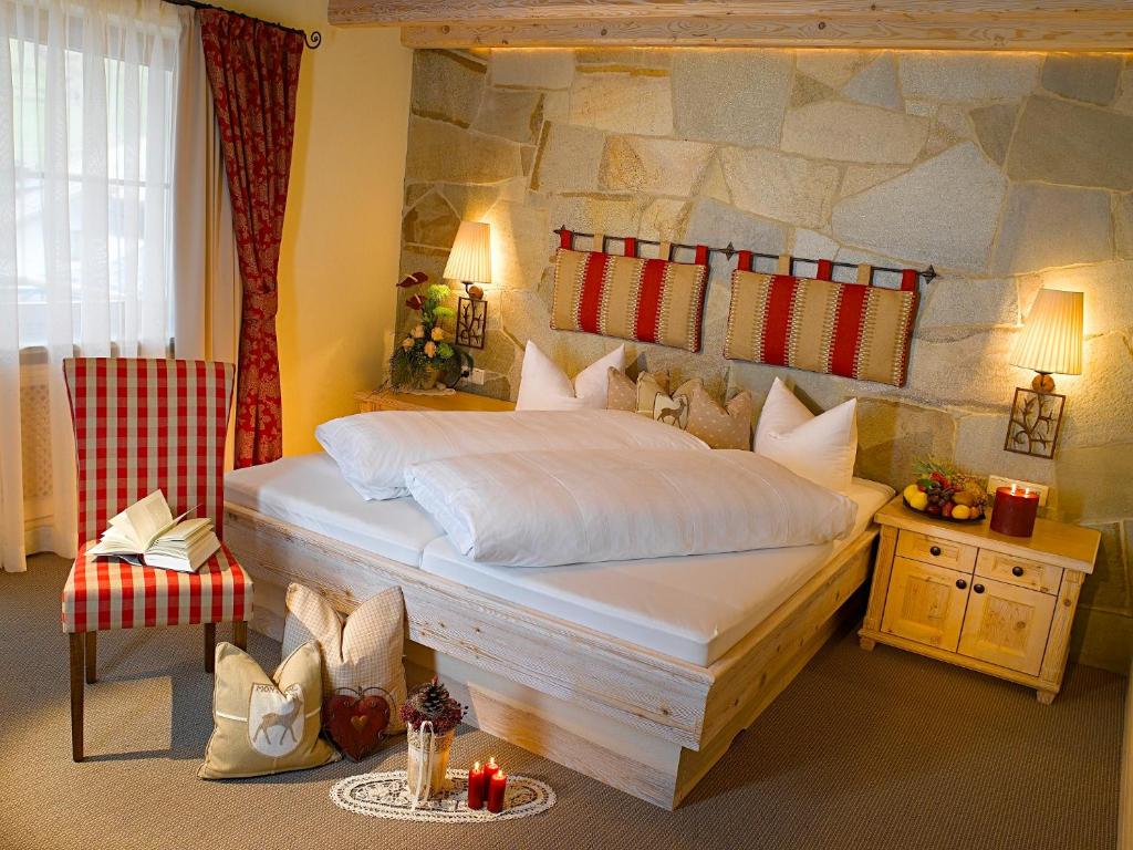 Postel nebo postele na pokoji v ubytování Boutique Hotel Montanara