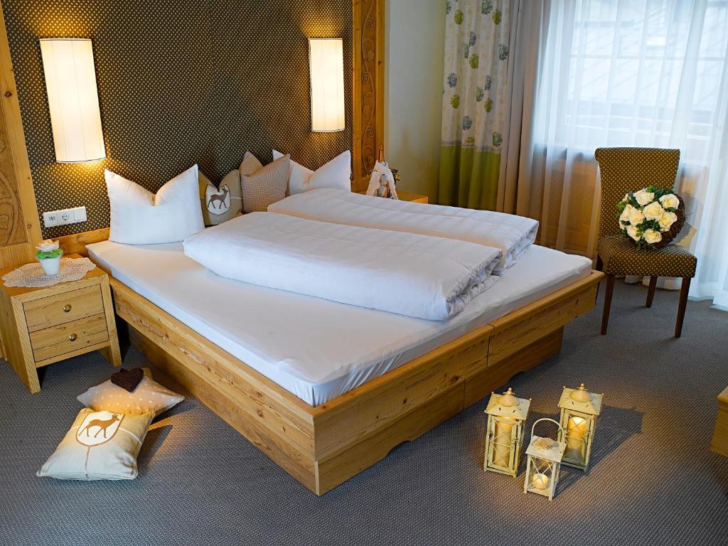 Postel nebo postele na pokoji v ubytování Boutique Hotel Montanara