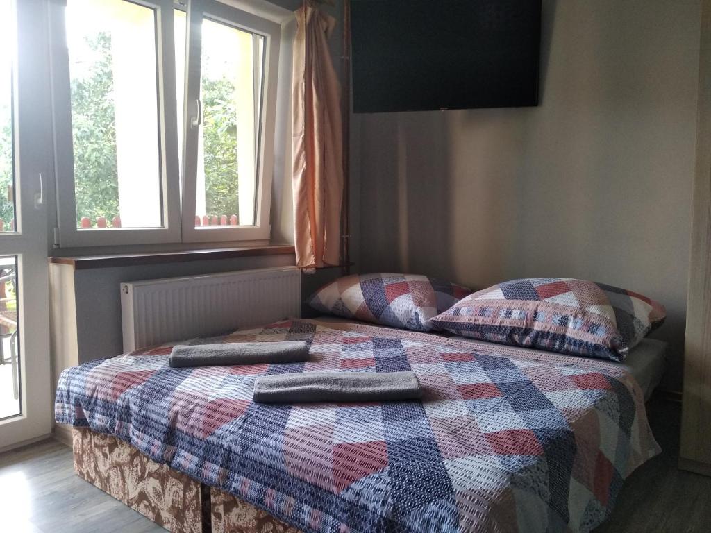 Postel nebo postele na pokoji v ubytování Penzion Burda