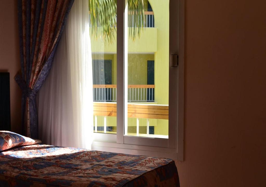 Postel nebo postele na pokoji v ubytování Palm Beach Resort Families and Couples only