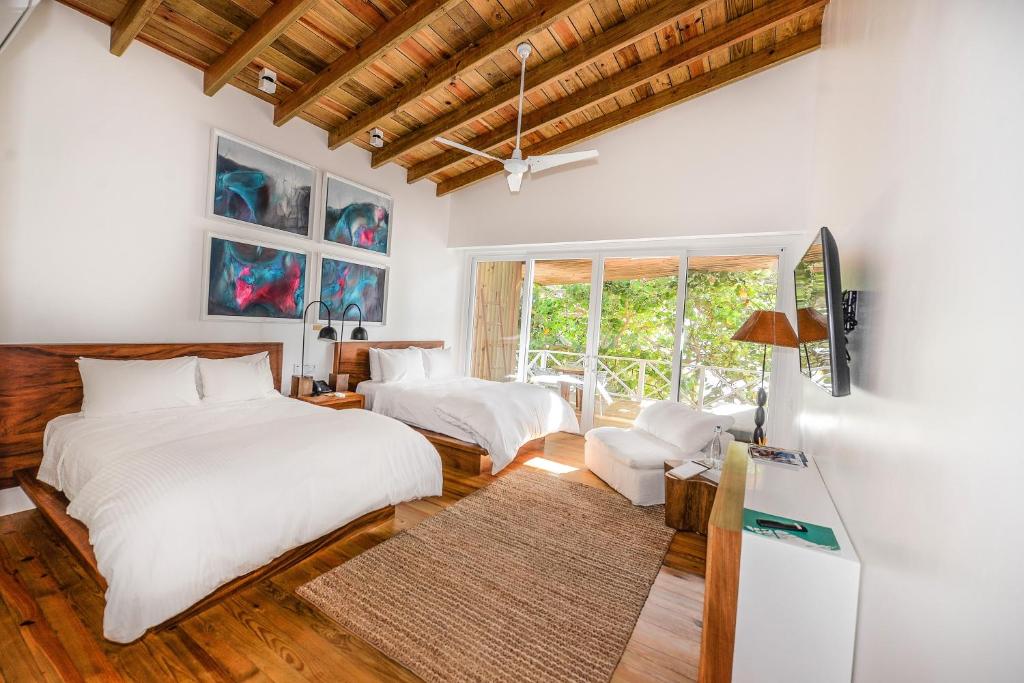 Postel nebo postele na pokoji v ubytování Ibagari Boutique Hotel
