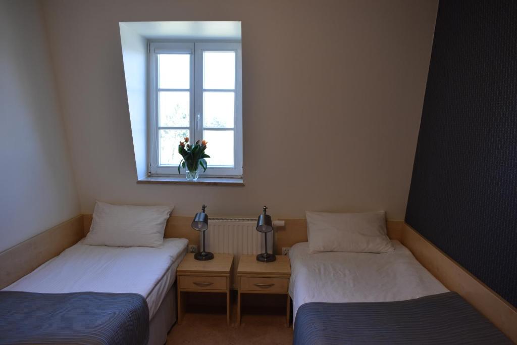 Postel nebo postele na pokoji v ubytování Eco Nieborów