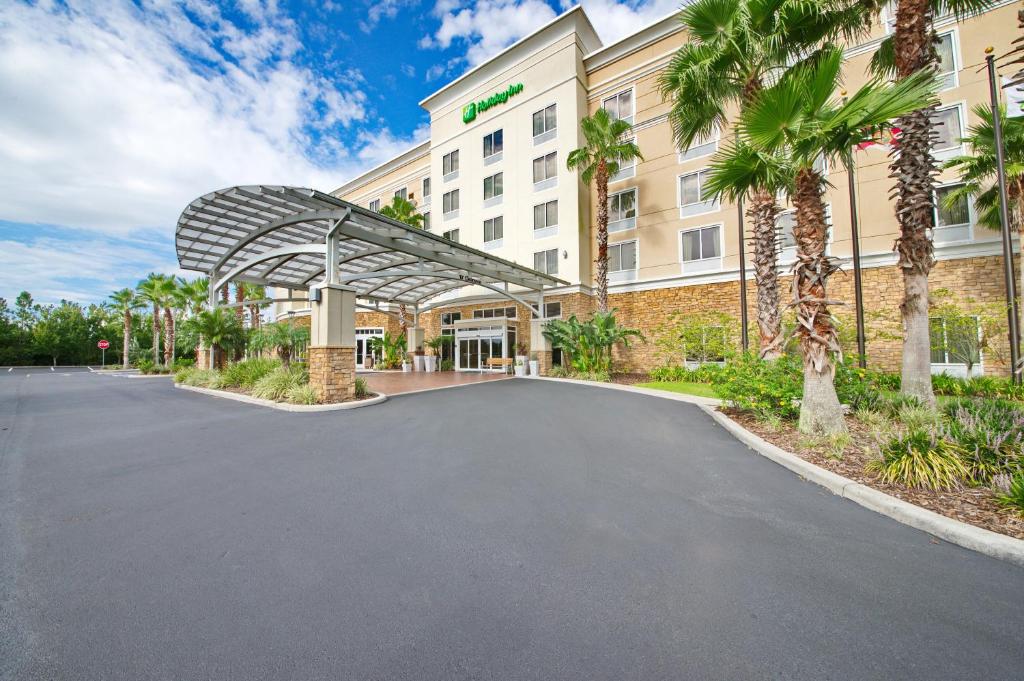 a rendering of the front of a hotel at Holiday Inn Titusville/Kennedy Space Center, an IHG Hotel in Titusville