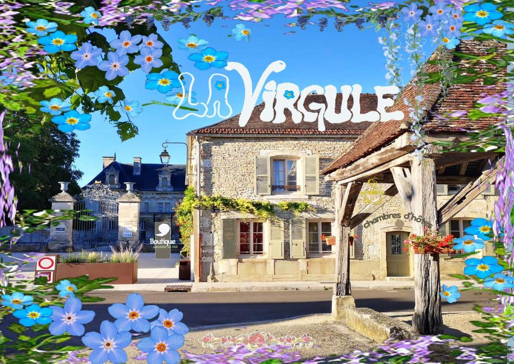 a picture of a building with flowers in front of it at La Virgule de Tanlay in Tanlay