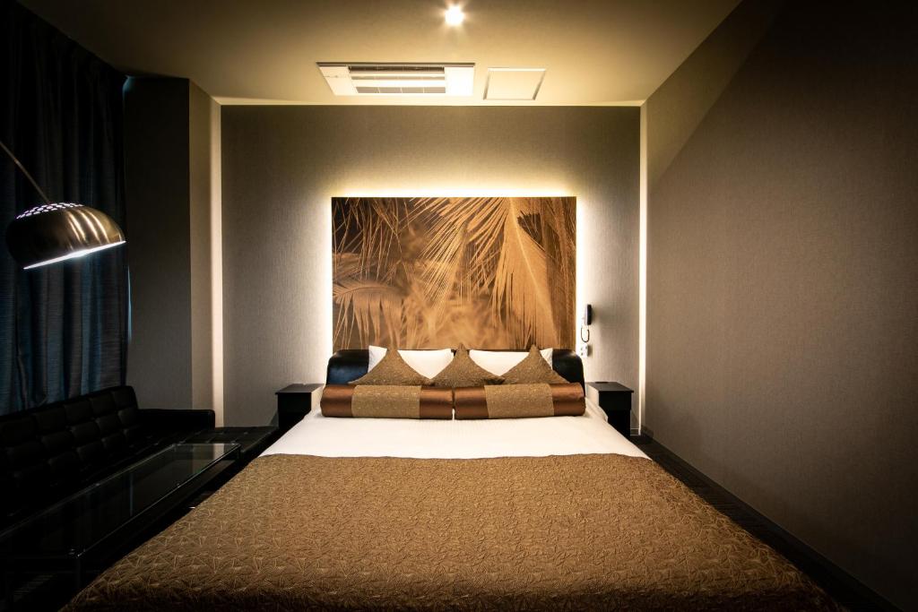 Postel nebo postele na pokoji v ubytování HOTEL BLAX