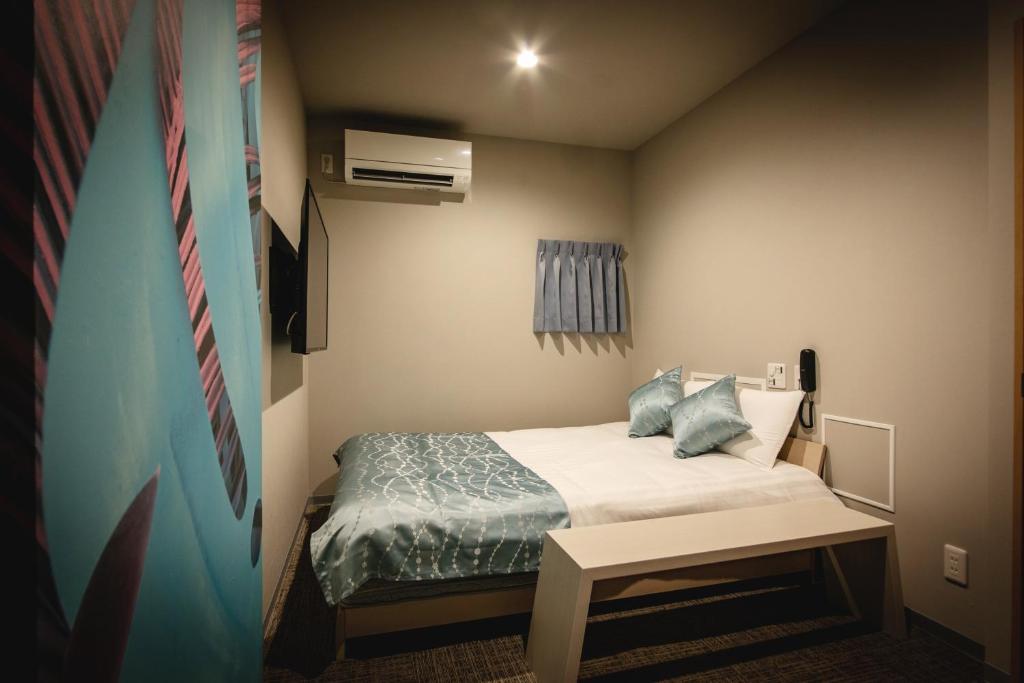Postel nebo postele na pokoji v ubytování HOTEL BLAX