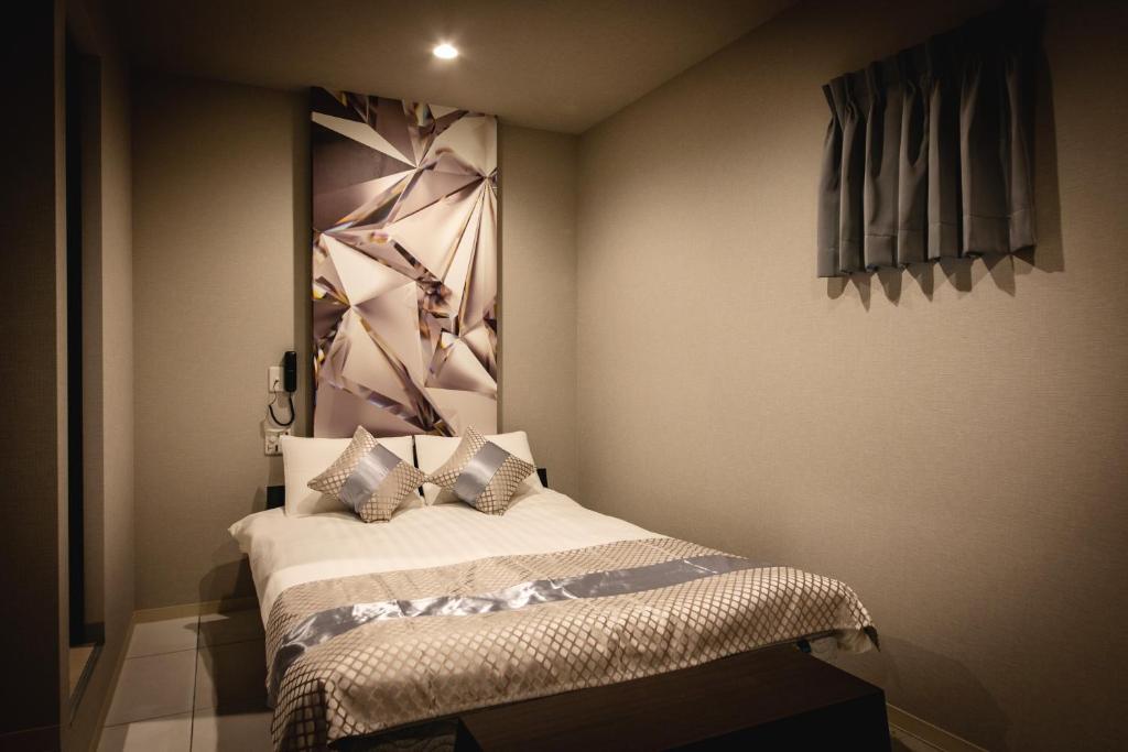 Postel nebo postele na pokoji v ubytování HOTEL BLAX