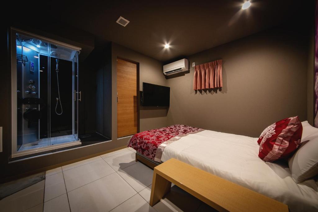 Postel nebo postele na pokoji v ubytování HOTEL BLAX