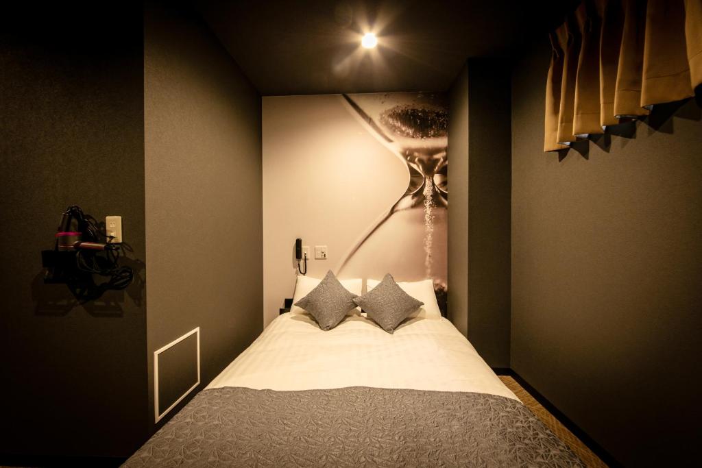 Postel nebo postele na pokoji v ubytování HOTEL BLAX