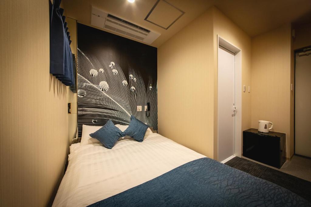 Postel nebo postele na pokoji v ubytování HOTEL BLAX