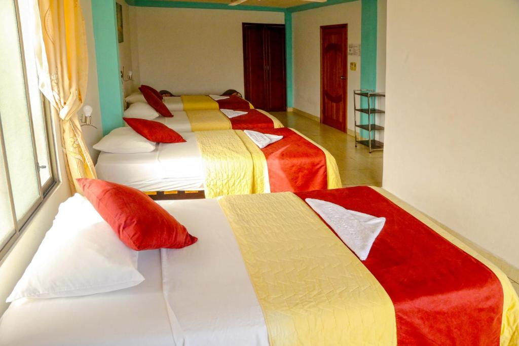 Postel nebo postele na pokoji v ubytování Hostal Sir Francis Drake