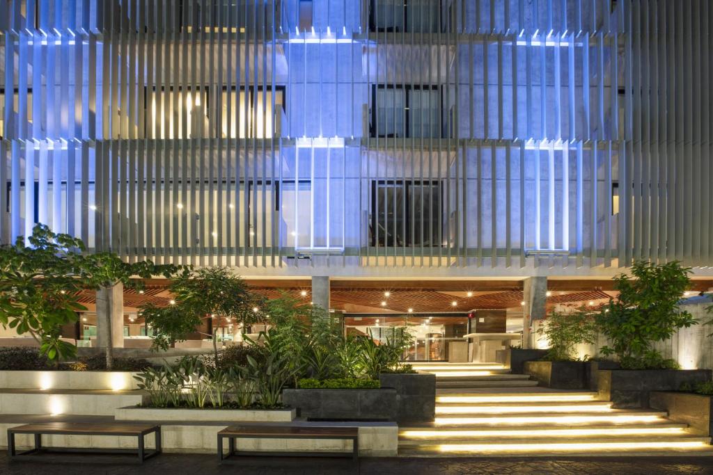 a building with benches in front of it at Mex Hoteles in Cancún