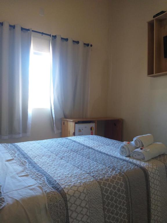 Postel nebo postele na pokoji v ubytování Pousada Capim Dourado