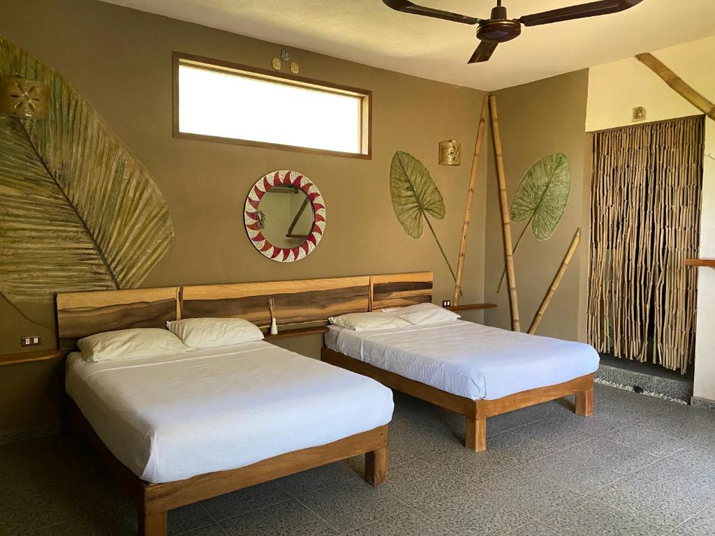 Postel nebo postele na pokoji v ubytování Villas Adriana, Palenque