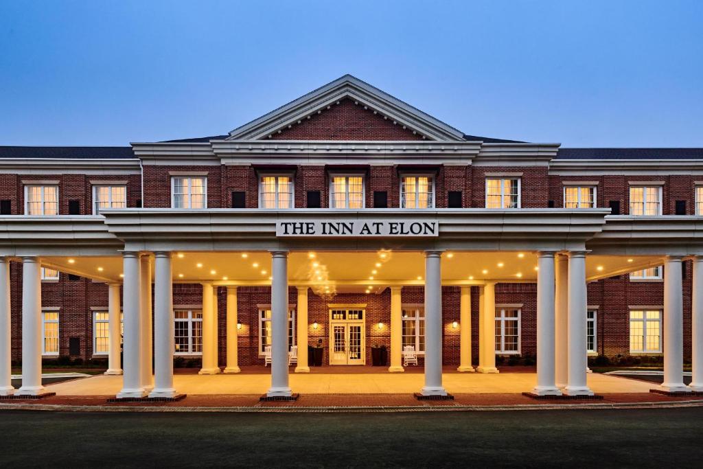 a building with a sign that reads the inn at elbow at The Inn at Elon in Elon