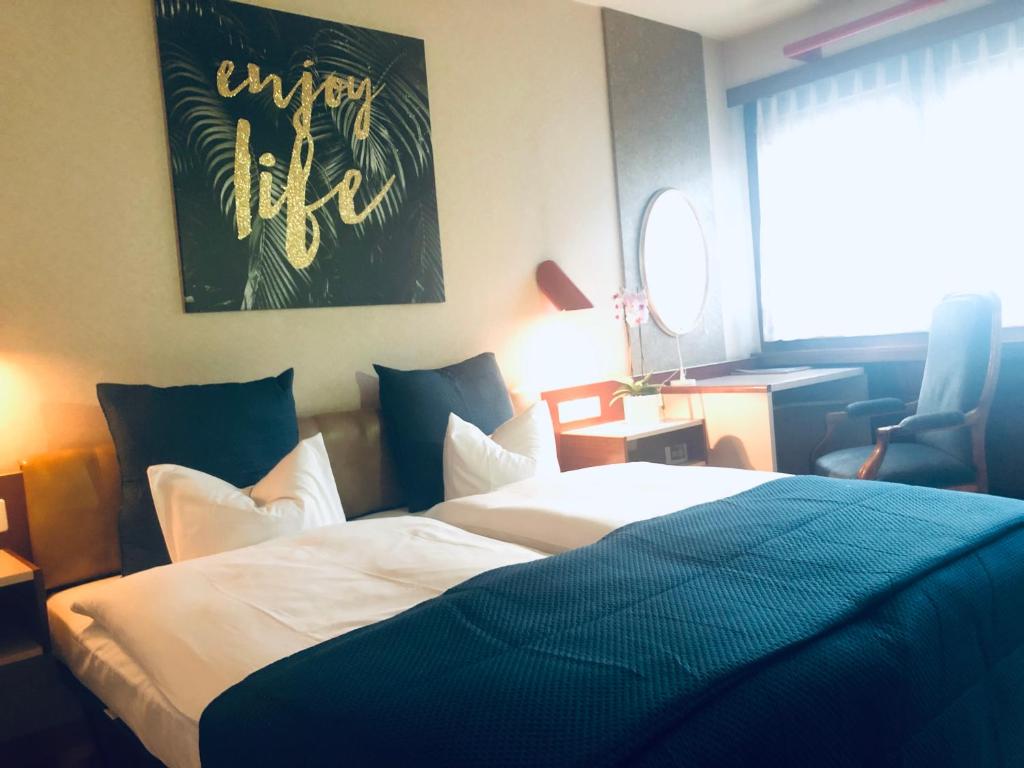 Postel nebo postele na pokoji v ubytování Hotel Casino