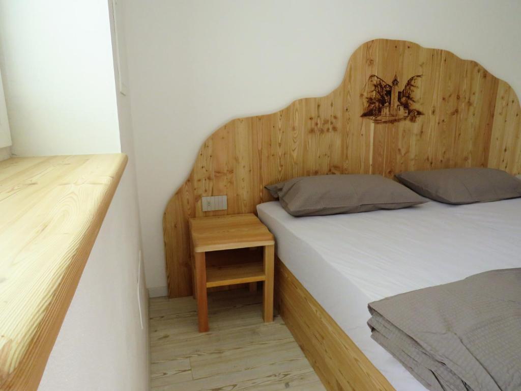 Postel nebo postele na pokoji v ubytování B&B A piè Paganella