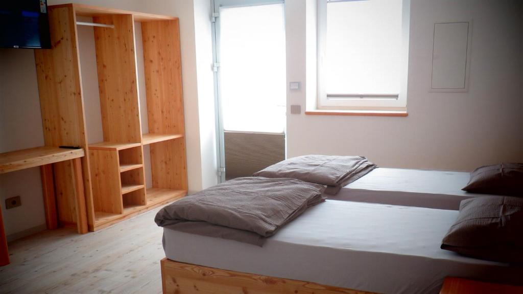 Postel nebo postele na pokoji v ubytování B&B A piè Paganella
