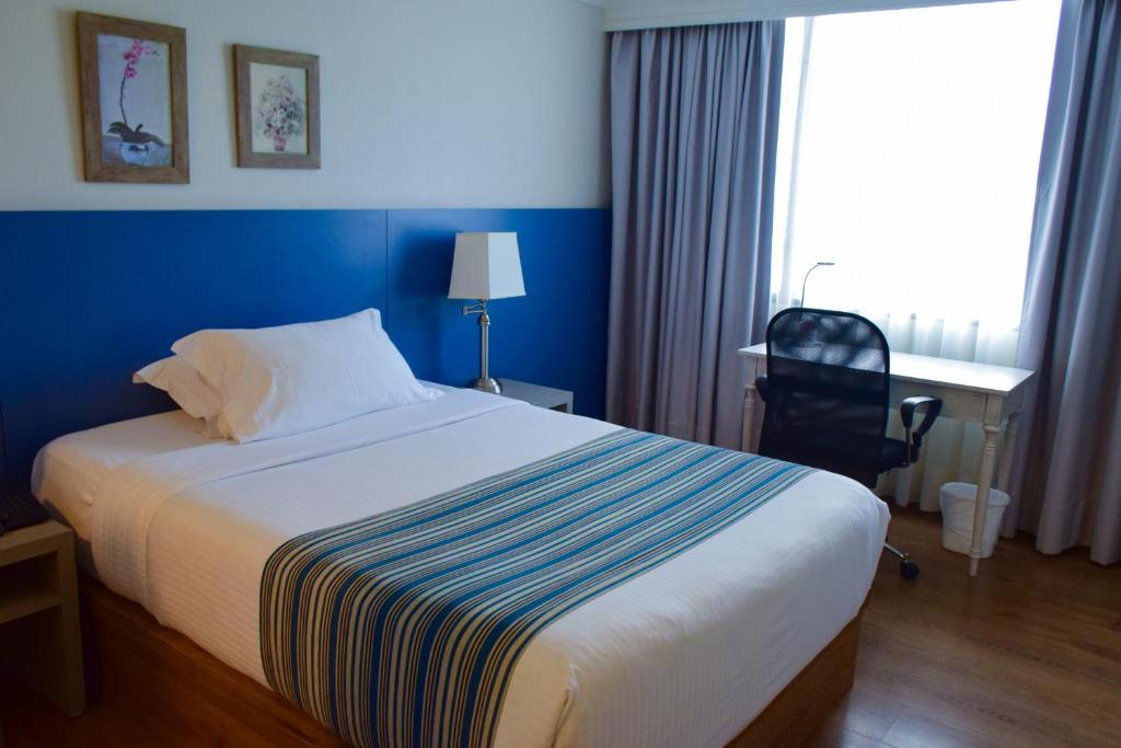 Postel nebo postele na pokoji v ubytování Hotel Saint Simon
