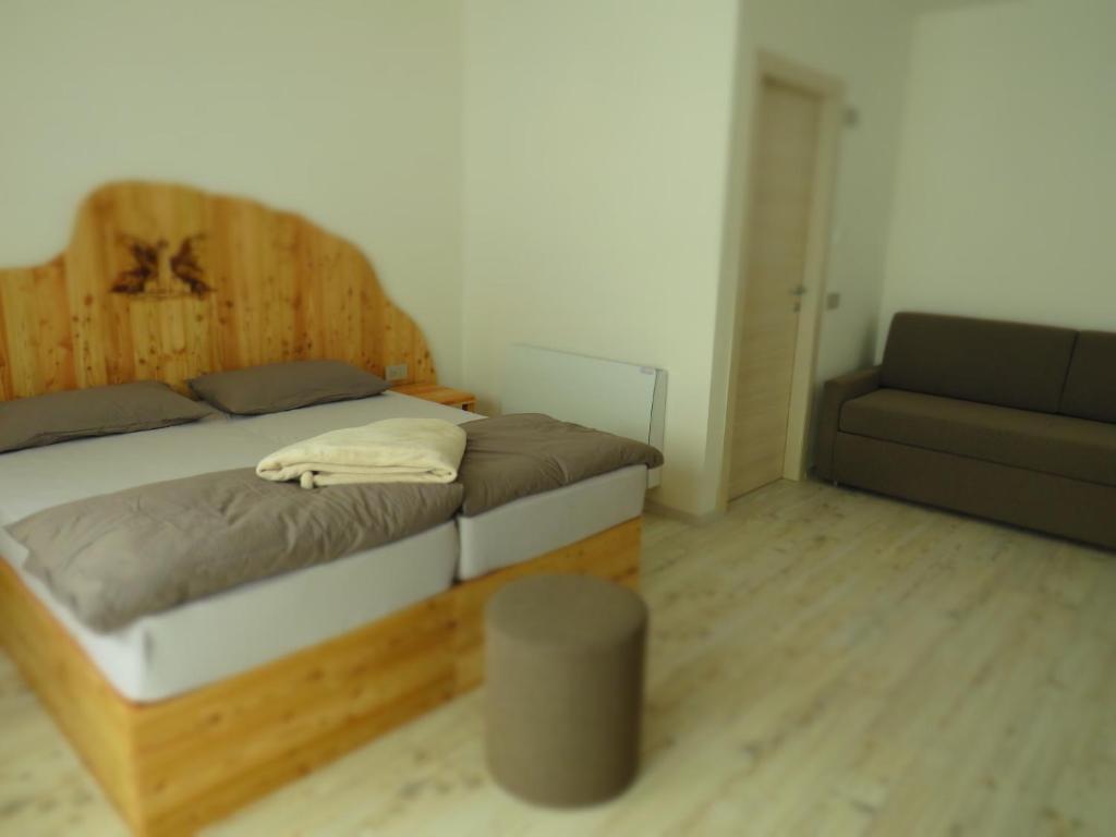 Postel nebo postele na pokoji v ubytování B&B A piè Paganella