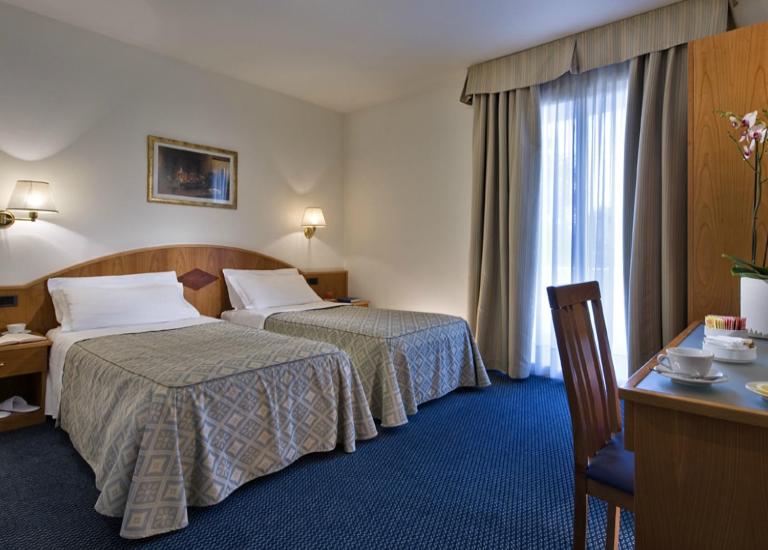 Posteľ alebo postele v izbe v ubytovaní Hotel Lo Zodiaco