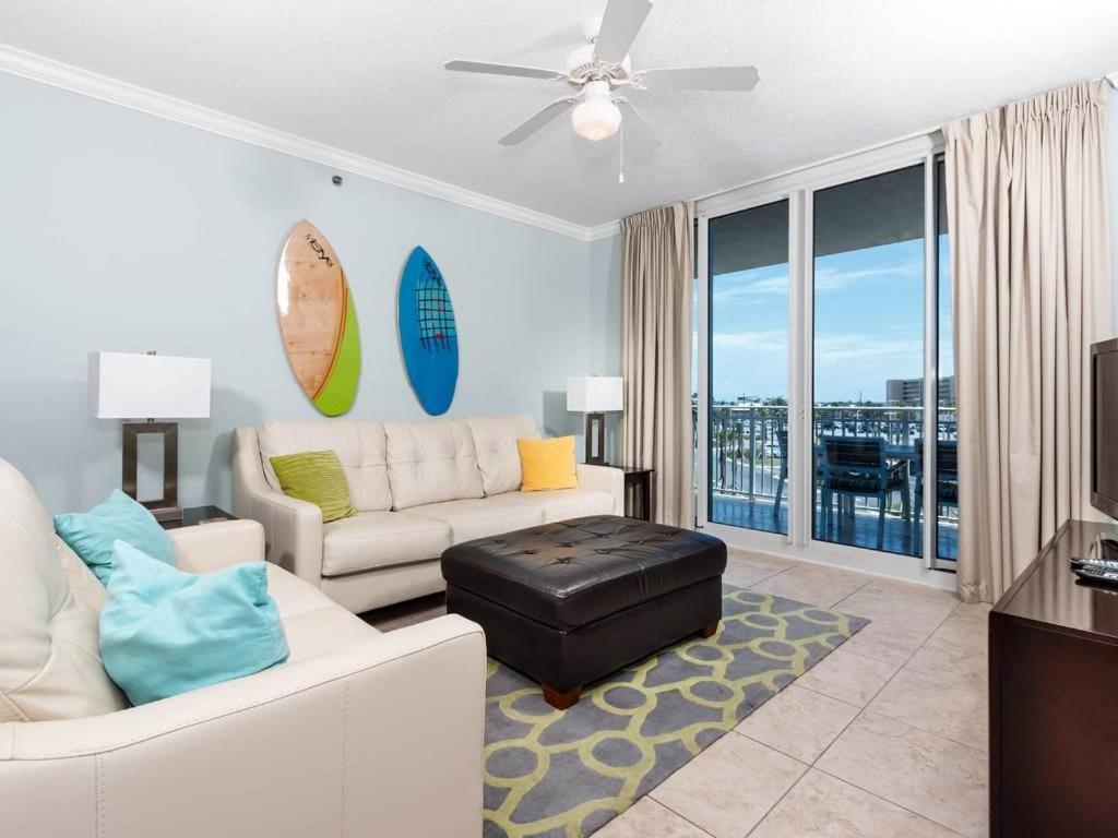 a living room with a white couch and a table at Waterscape A V in Fort Walton Beach