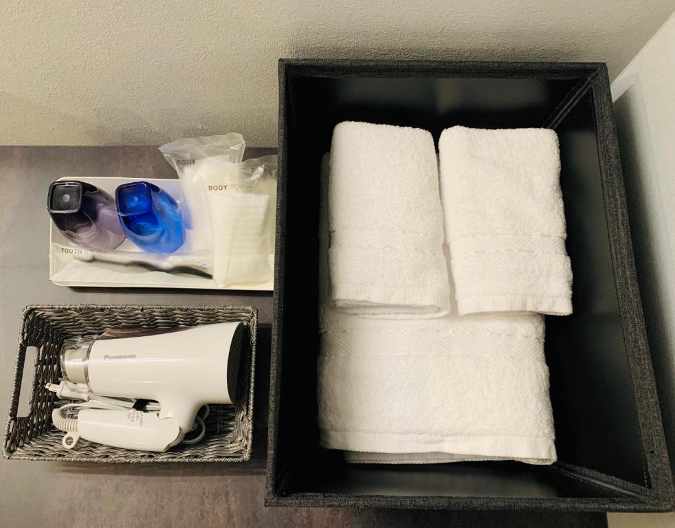 Postel nebo postele na pokoji v ubytování HOTEL TABARD TOKYO
